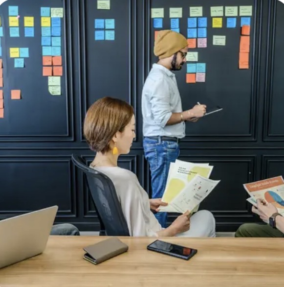 Strategists mapping scenarios on a planning wall